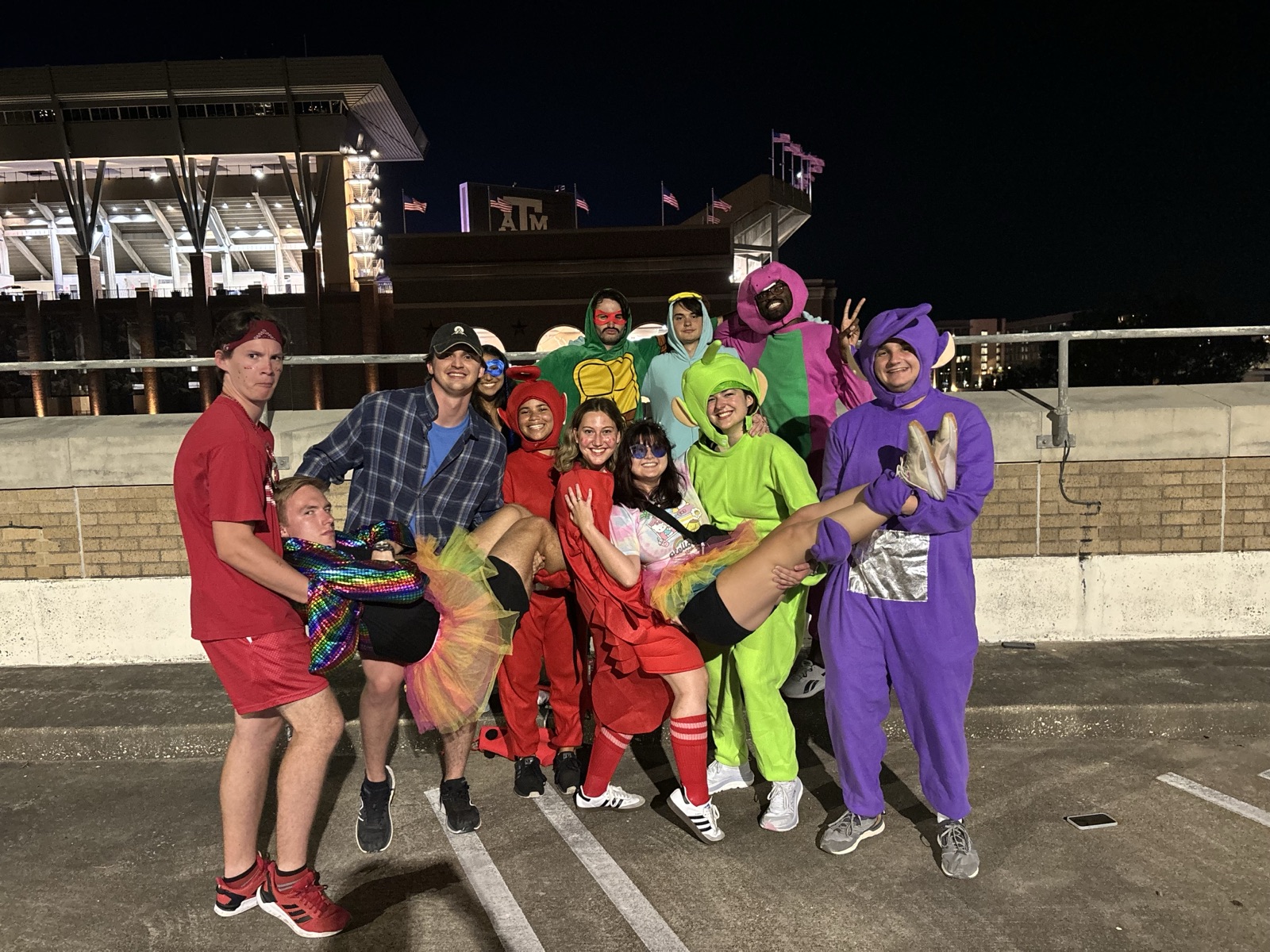 A big group in costumes at a Texas A&M football game