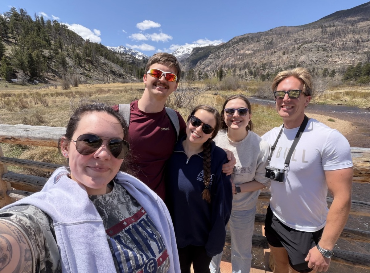 Nick and four friends taking a selfie in the mountains